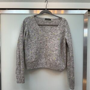 Gray V-Neck Sweater with Pastel Accents